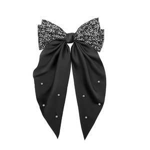 Vintage floral bow hair clip with white pearls and long black streamers on white background