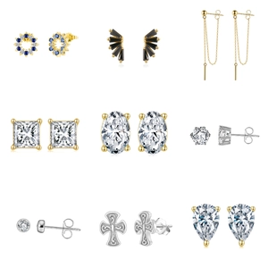Detailed grid of S925 sterling silver earrings with zircons and cross pendant designs