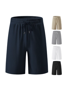 Detailed view of corduroy texture, elastic waistband and drawstring on men's summer shorts