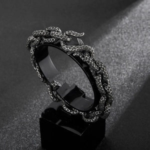Close-up of vintage snake scale texture on antique silver titanium steel wide chain ring