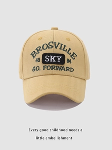 Detailed view of SKY letter embroidery and precise stitching on khaki baseball cap