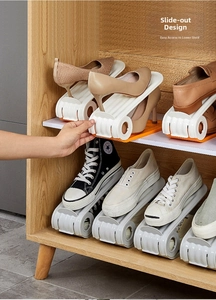 Close-up of double-layer plastic shoe organizer with handle for easy pull-out storage
