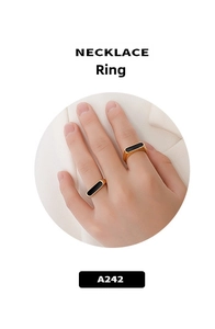 Detailed view of two minimalist 18K gold plated rings with black enamel rectangular inlay