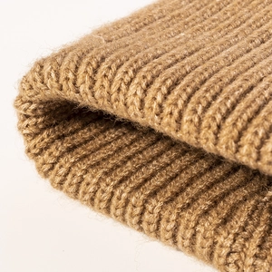 Camel ribbed knit beanie for winter warm headwear showing thick wool texture