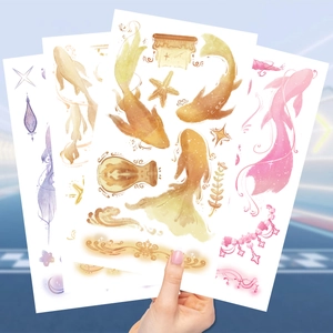 Three sheets of waterproof koi fish and star temporary tattoos in vibrant watercolors