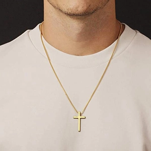 Male model wearing a classic gold titanium steel cross pendant necklace in minimalist style