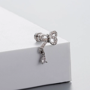 Silver bow stud earrings in titanium steel with zircon stones and water drop pendant
