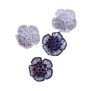 Sparkling camellia stud earrings with multilayered zircon petals in a floral design