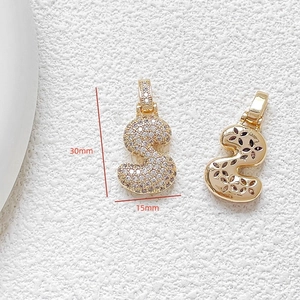 Detailed view of gold-plated letter S pendant with zircon inlay and 30x15mm dimensions