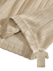 Macro detail of vertical stripe textured waffle knit fabric on beige men's polo shirt
