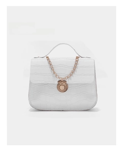 Close-up of white crocodile pattern bag with vintage gold hardware and chain strap