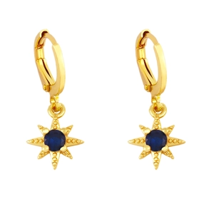 Detail of gold huggie earrings featuring navy blue crystals in an eight-pointed star pendant