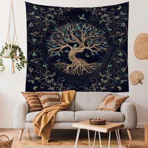 Detail of Tree of Life tapestry with golden tree and birds hanging in a cozy living room