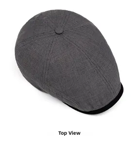 Top view of dark grey summer flat cap with waffle texture and black brim detail