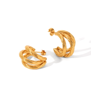 Minimalist gold twisted C-shaped hoop earrings with vintage braided texture in high polish