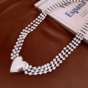 Three-layer silver body chain with sparkling rhinestones and a large heart pendant