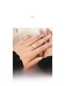 Detailed view of an elegant S925 sterling silver ring featuring a white pearl and textured band