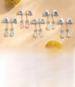Detailed view of silver cat ear cartilage studs with colorful zircon and screw back