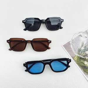 Retro square sunglasses with metallic rivet accents in black, tea, and blue lens colors