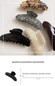 Détail macro de pinces à cheveux en acétate de 10,5 cm avec motifs écaille et perle