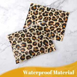 Waterproof EVA makeup bag with leopard print on a marble background with water droplets