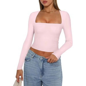 Pink long sleeve square neck crop top paired with blue jeans against a white background