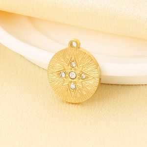 Macro shot of gold circular starburst pendant with five micro-set sparkling crystals