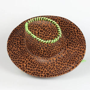 Close-up of leopard print cowboy hat with vibrant green hand-stitched detailing