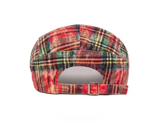 Detailed back view of vintage plaid beret with adjustable metal buckle strap