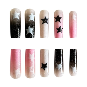 Long square gradient press-on nails in black pink and white with star patterns and glitter
