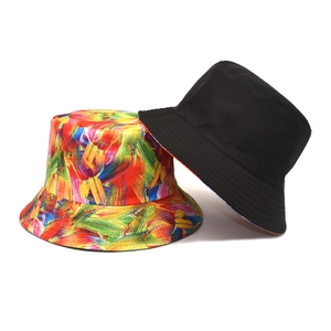 Colorful tie-dye and reversible solid black bucket hats with stitched brim detail
