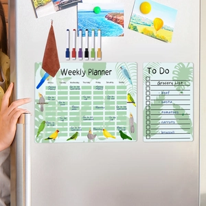 Magnetic weekly planner and to-do list with bird illustrations on a fridge door