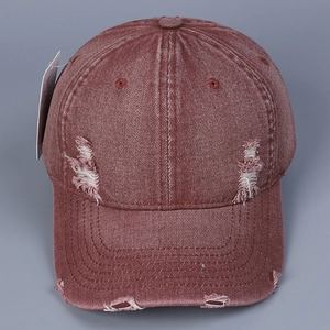 Vintage red washed denim baseball cap with distressed ripped details and curved brim
