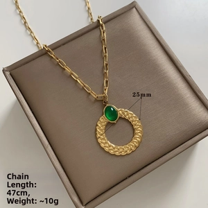 Detail of gold twisted pendant necklace with green stone, 47cm chain length and 10g weight
