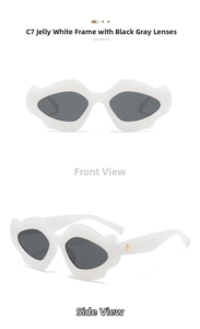 Detail view of jelly white irregular sunglasses frame with gold star accent and grey lens