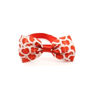 Close-up of red and white heart pattern bowtie showing ribbed fabric texture detail