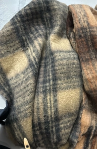 Detailed texture of the soft brown and beige plaid wool fabric on this vintage scarf