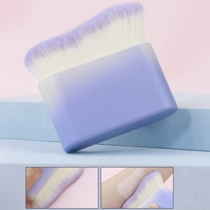 Macro detail of high-density gradient bristles applying foundation on skin smoothly