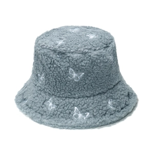 Close-up of light blue lamb wool bucket hat with white butterfly embroidery detail