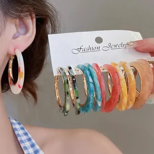 Tortoiseshell resin C-shaped hoop earring set in multiple colors with gold clasps
