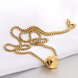 Minimalist 12mm gold cube pendant necklace with box chain on elegant white silk