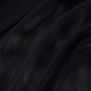Close-up of black breathable mesh fabric with fine honeycomb texture and soft draping
