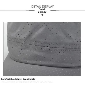 Detailed macro view of the grey outdoor cap featuring breathable mesh fabric and fine stitching