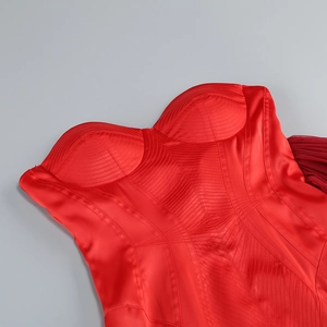 Detailed close-up of red satin corset stitching and premium fabric texture on the evening dress