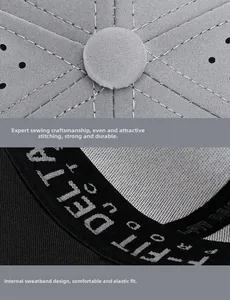 Detail of grey fabric cap showing circular top stitching and breathable mesh inner lining
