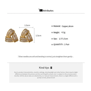 Macro shot showing dimensions of zircon triangle earrings with silver needle details