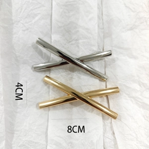 Detail showing dimensions of 8cm and 4cm for gold and silver geometric hair clips