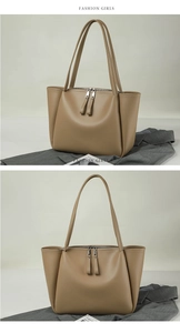 Detail of khaki tote bag with dual zipper design and side fold gussets on soft leather
