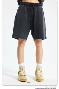 Close-up of retro washed black heavy cotton shorts with drawstring elastic waist texture