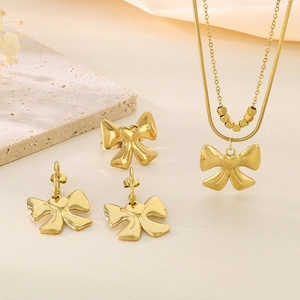 Elegant 18K gold plated bow jewelry set with layered snake chain, earrings and ring